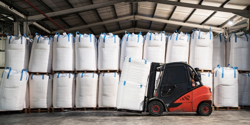 Forklift Carrying chemical sack in storage room